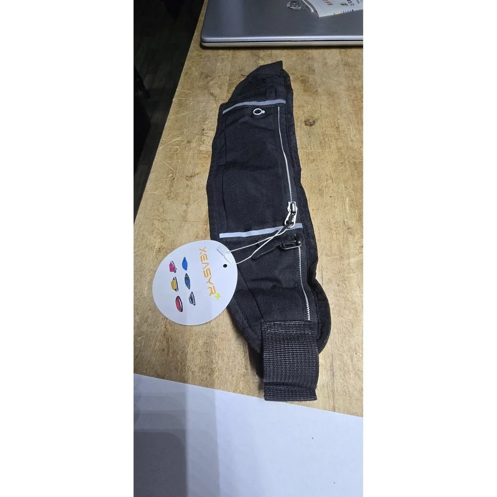 Xeasyr brand black running belt designed for carrying small essentials like phon